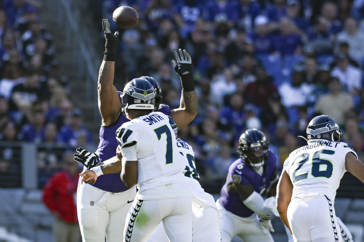 Baltimore Ravens defensive tackle Travis Jones (98) blocks Seattle Seahawks quarterback Geno Smith (7) first half pass during the first half at M&T Bank Stadium.
